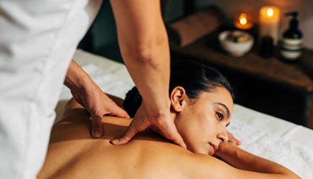 Relaxing back and neck massage in spa with therapist providing deep tissue relief