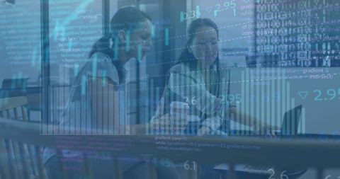 Diverse Women Analyzing Stock Market Data in Office
