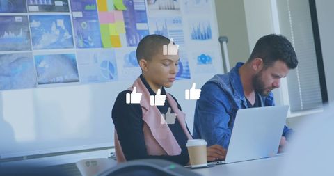 Professional Team Collaborating with Social Media Engagement Icons