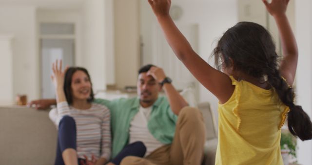 Young Family Enjoying Quality Time at Home with Excited Child Indoors - Download Free Stock Images Pikwizard.com