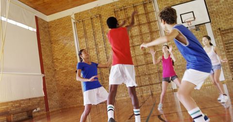 Energetic High School Students Engaged in Basketball Game