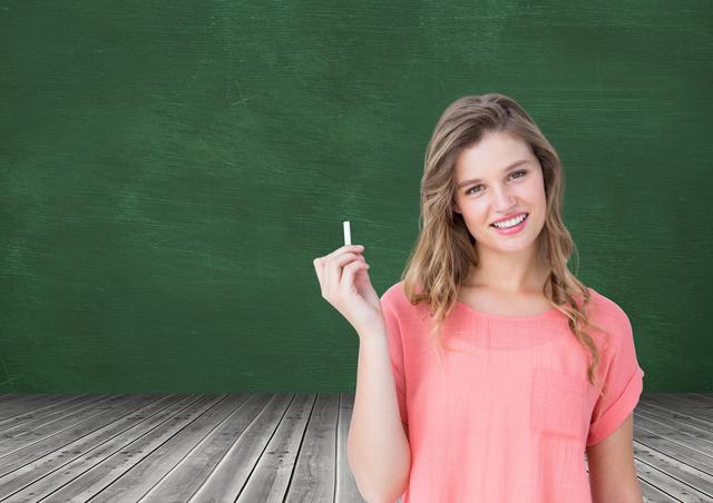 Digital composition of woman holding a chalk against green board