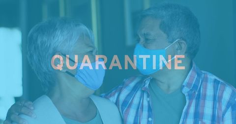 Senior couple embracing with face masks during quarantine