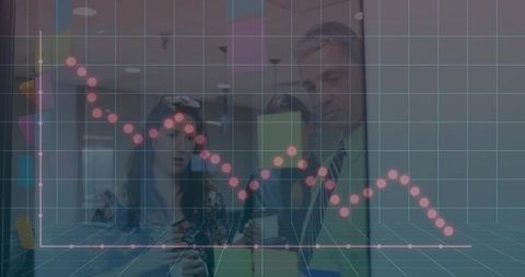 Business team examining falling sales trend overlaid on teal grid in modern office lobby