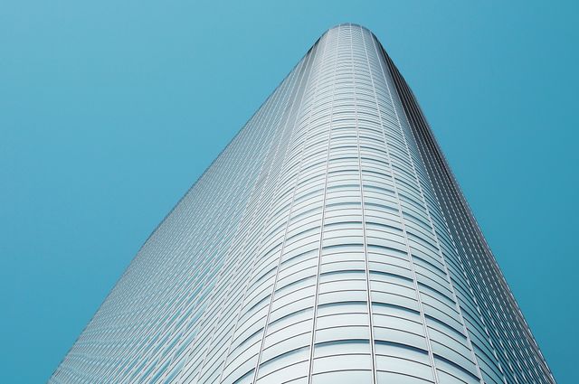 Impressive Modern Glass Skyscraper Reaching Towards Blue Sky - Download Free Stock Photos Pikwizard.com