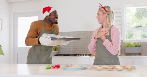 Diverse Couple Baking Festive Cookies Together Indoor Celebration