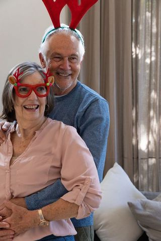 Senior Couple Celebrating Joyful Festive Season at Home