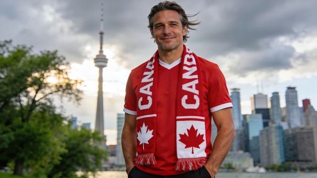 Proud canadian fan standing toronto waterfront wearing canada scarf and red jersey