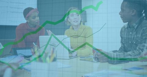 Diverse Team Collaborating in Modern Office with Graph Overlay