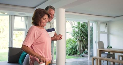 Senior Couple Sharing Laughter Together Indoors
