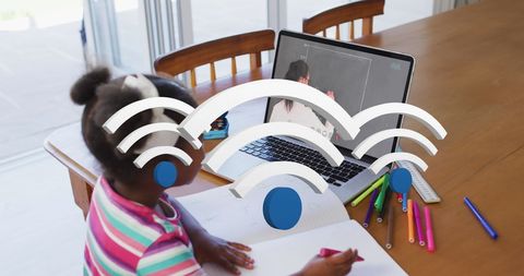 Young african american girl engaging in interactive online learning at home