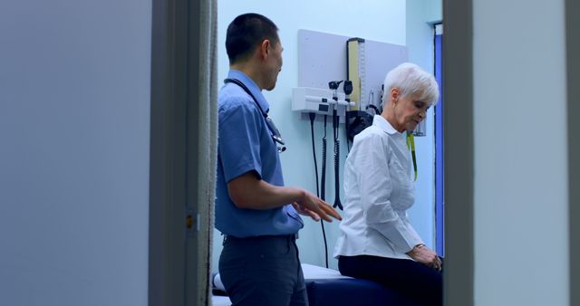 Doctor Discussing Medical Concerns with Elderly Patient in Clinic - Download Free Stock Images Pikwizard.com