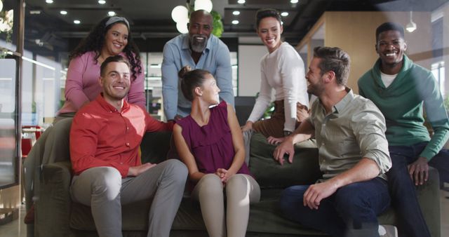 Diverse Group of Office Workers Socializing Together on Couch - Download Free Stock Images Pikwizard.com