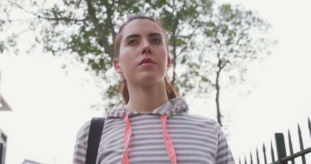 Young Woman Outdoors Looking Determined Under Trees - Download Free Stock Images Pikwizard.com