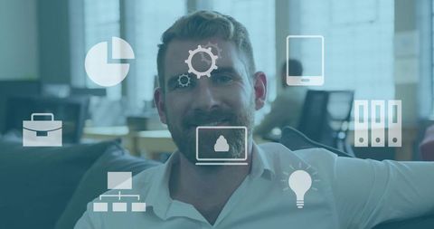 Smiling entrepreneur leaning back in coworking lounge with cloud, analytics and productivity icons