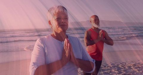 Yoga at Sunset on Beach with Senior Practitioners