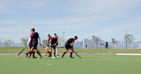 Team Practice and Training Session for Field Hockey Players Outdoors