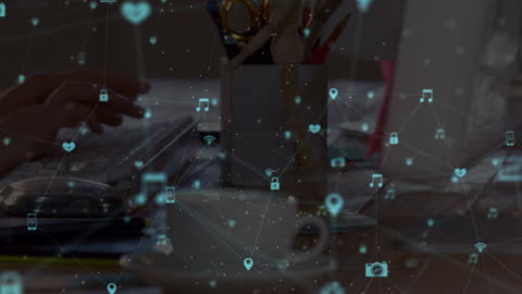 Hands Typing on Keyboard with Digital Media Icons Overlay