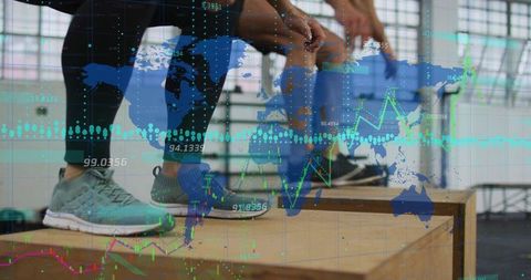 Athlete duo balancing on plyo boxes tying shoes with data overlay for fitness analytics