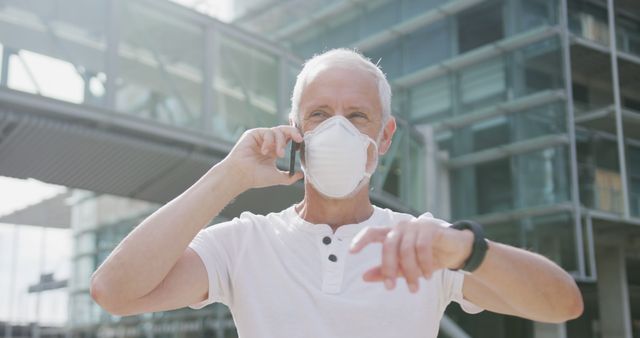 Senior Man Wearing Mask Talking on Phone Outside Modern Building - Download Free Stock Images Pikwizard.com