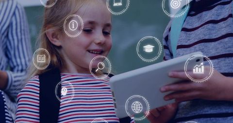 Smiling schoolgirl using tablet with education icons for digital classroom learning