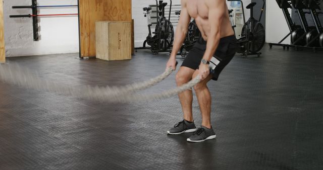 Man Exercising with Battle Ropes in Gym - Download Free Stock Images Pikwizard.com