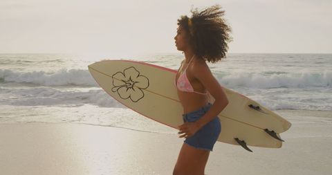 African American Female Surfer Running with Surfboard at Beach - Download Free Stock Images Pikwizard.com