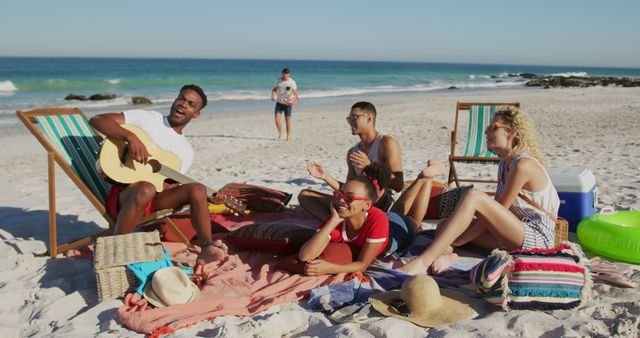 Friends Enjoying a Beach Outing with Guitar and Relaxed Vibes - Download Free Stock Images Pikwizard.com