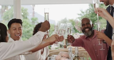 Joyful Wedding Celebration Toast with Happy Guests