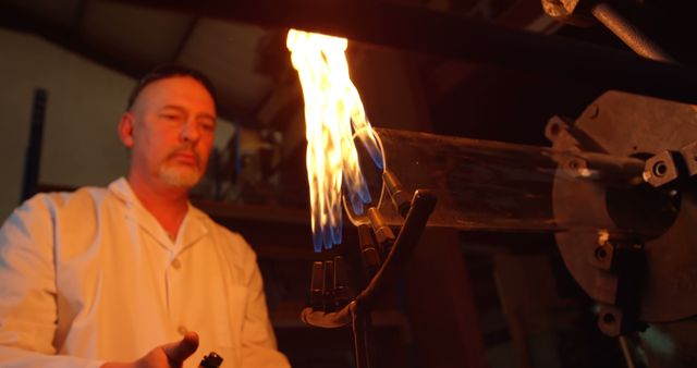 Mature Man Crafting Glass with Intense Fire - Download Free Stock Images Pikwizard.com