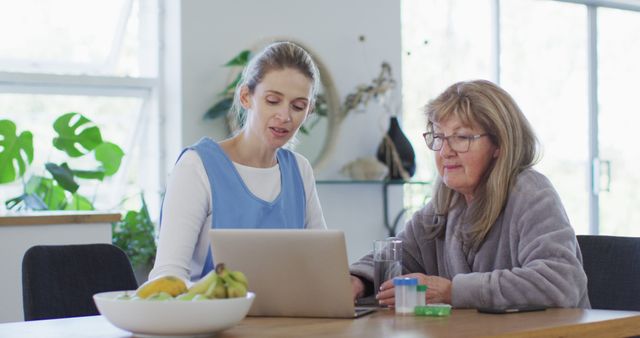 Healthcare Worker Assisting Senior Woman with Laptop at Home - Download Free Stock Images Pikwizard.com