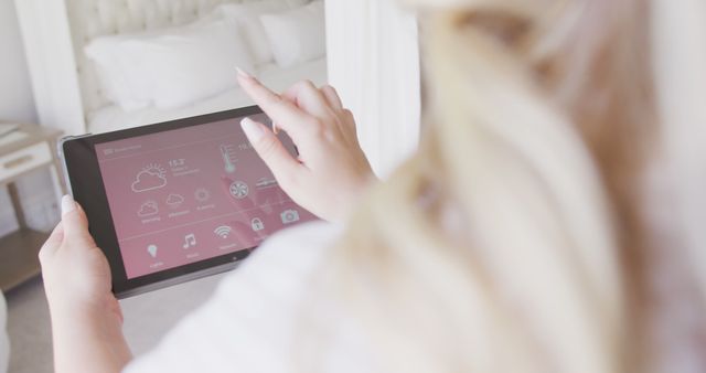 Woman Controlling Smart Home System with Tablet in Bedroom - Download Free Stock Images Pikwizard.com