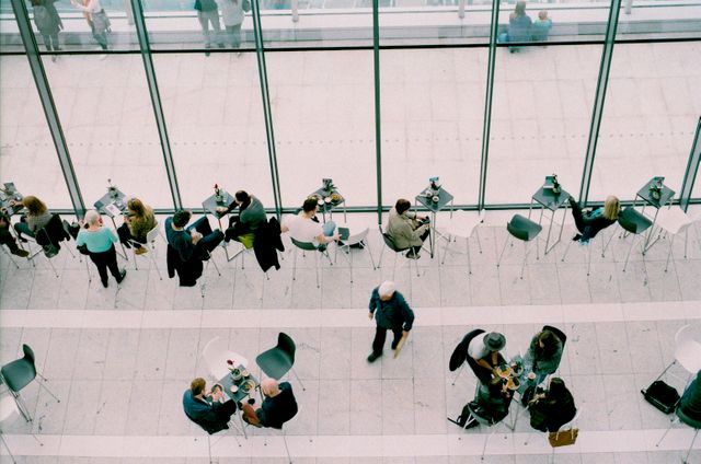 High Angle View of People Socializing in Modern Atrium - Download Free Stock Images Pikwizard.com