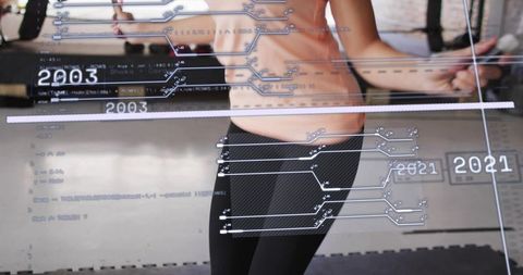 Holding jump rope handles skipping workout with futuristic fitness data overlay 2003 2021