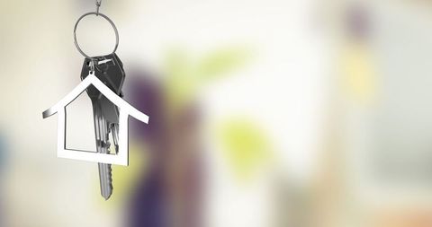 Silver House Keychain Symbolizing New Home Ownership