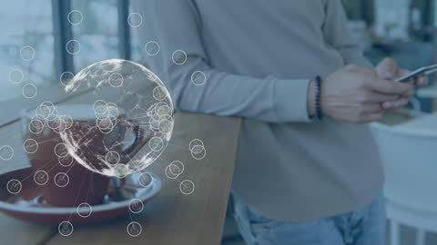 Global Network Concept with Man Using Smartphone in Cafe