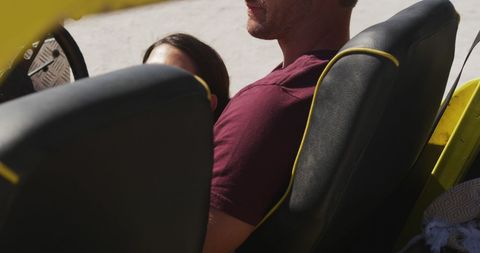 Couple Relaxing in Beach Buggy Near Ocean on Summer Day