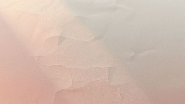 Minimalist textured plaster surface with pastel gradient