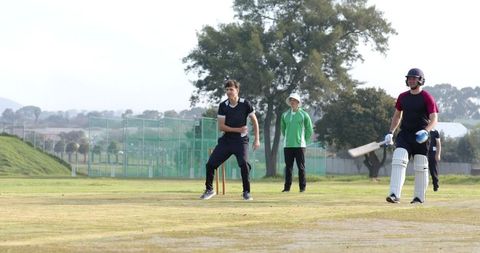 Cricketer preparing delivery on outdoor pitch