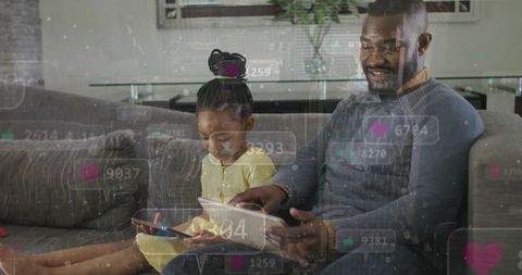 African american father and daughter sharing tablet and phone, scrolling social media on cozy sofa