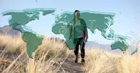 Asian Hiker with Backpack and Map Overlay in Landscape