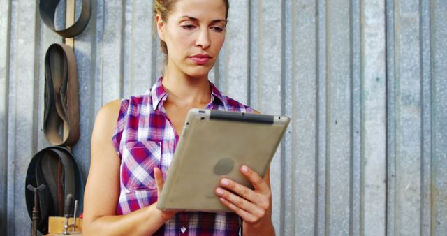 Female Carpenter Using Digital Tablet in Workshop - Download Free Stock Images Pikwizard.com