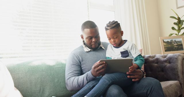 Father and Son Spending Quality Time Using Tablet At Home - Download Free Stock Images Pikwizard.com