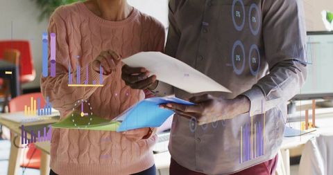 Professionals Collaborating on Analytics in Modern Office