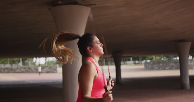 Young Woman Jump Roping Under Covered Patio - Download Free Stock Images Pikwizard.com