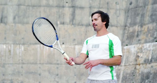 Man Practicing Tennis Against Concrete Wall - Download Free Stock Images Pikwizard.com