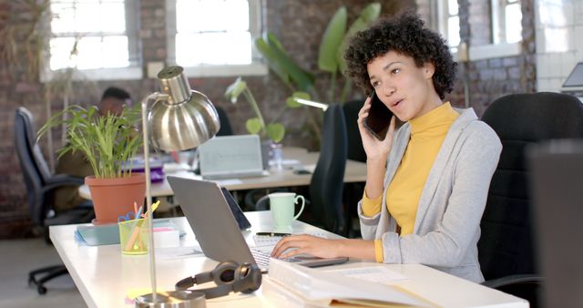 Businesswoman Having Phone Conversation in Modern Office - Download Free Stock Images Pikwizard.com