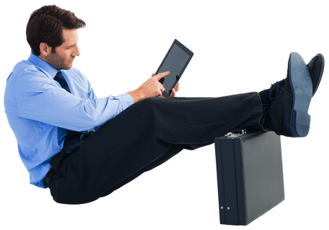 businessman in blue shirt using tablet with feet on suitcase transparent background - Download Free Stock Videos Pikwizard.com