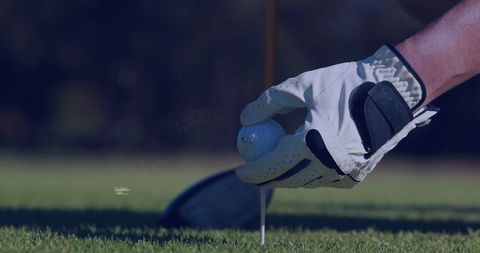 Close-Up of Golf Player Setting Ball on Tee with Focus on Gloved Hand - Download Free Stock Images Pikwizard.com