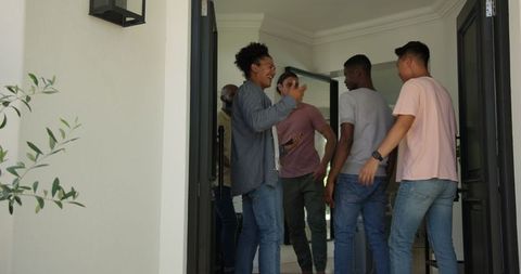 Friends Embracing Joyful Reunion, Ready for Wedding Celebration